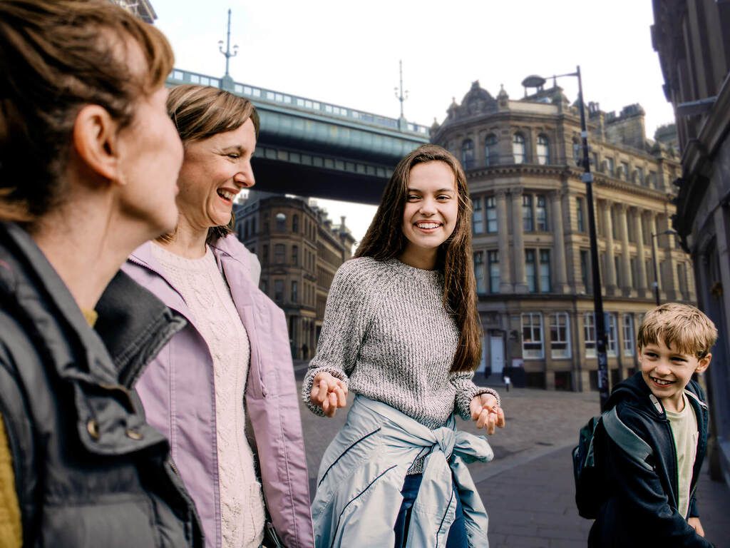 A family walking through the streets of Newcastle