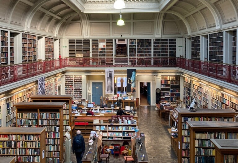 Numerous bookcases lining the walls of the Lit & Phil independent library.